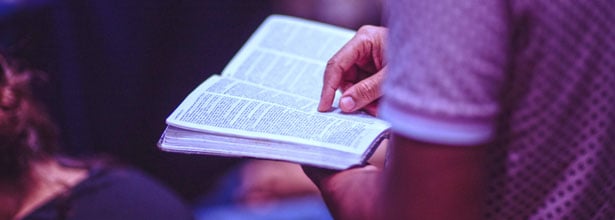 closeup of man reading the bible