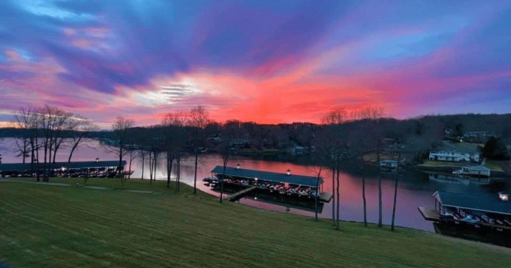 Sunrise of purple and red over a dock at Smith Mountain Lake, VA.