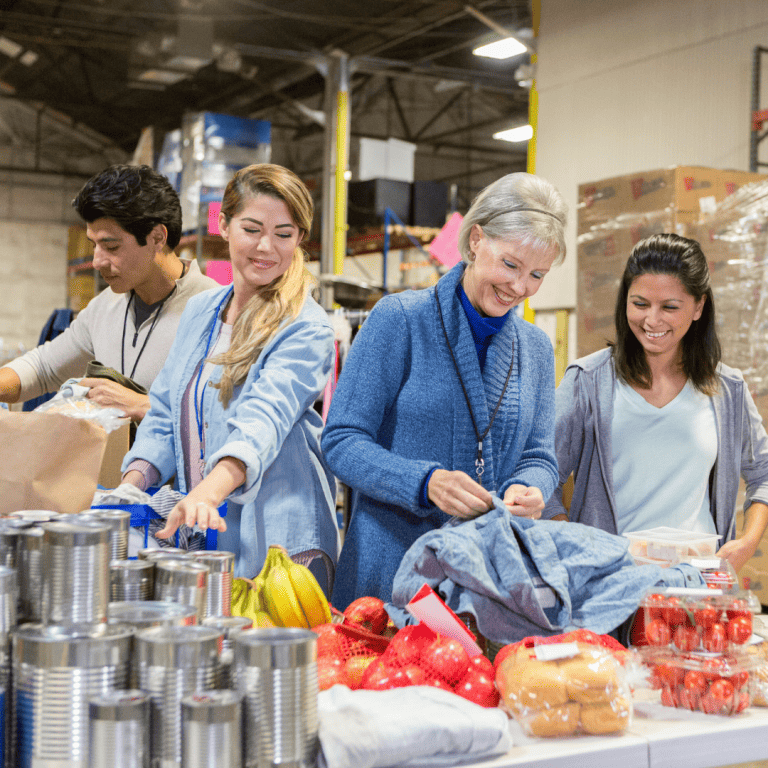 Volunteers packing boxes at a food bank