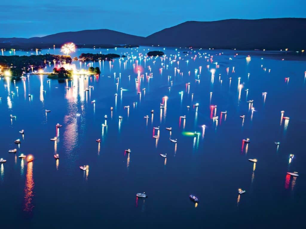 Colorful fireworks light up the sky over the water at Smith Mountain Lake.