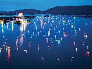 Colorful fireworks light up the sky over the water at Smith Mountain Lake.