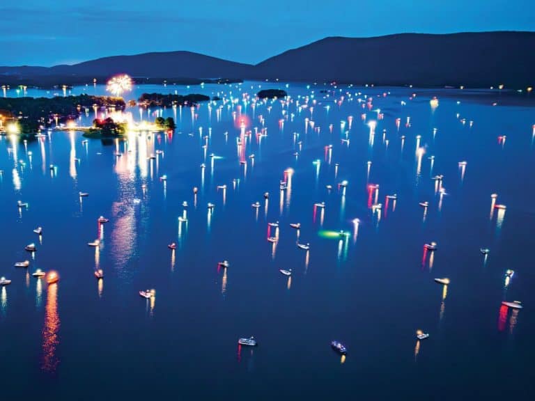 Colorful fireworks light up the sky over the water at Smith Mountain Lake.